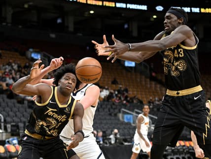 Feb 12, 2022; Toronto, Ontario, CAN;  Toronto Raptors forwards Pascal Siakam (43) and OG Anunoby (3) reach for a loose ball against the Denver Nuggets in the first half at Scotiabank Arena. Mandatory Credit: Dan Hamilton-USA TODAY Sports