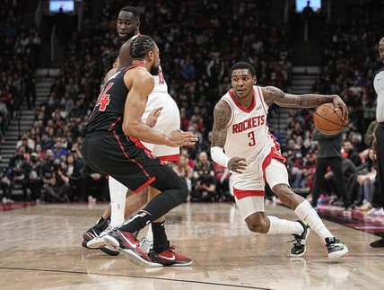 Apr 8, 2022; Toronto, Ontario, CAN; Houston Rockets guard Kevin Porter Jr. (3) drives to the basket against Toronto Raptors center Khem Birch (24) during the first half at Scotiabank Arena. Mandatory Credit: John E. Sokolowski-USA TODAY Sports