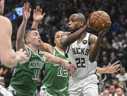 Apr 7, 2022; Milwaukee, Wisconsin, USA;  Milwaukee Bucks forward Khris Middleton (22) gets pressure from Boston Celtics guard Payton Pritchard (11) in the first quarter at Fiserv Forum. Mandatory Credit: Benny Sieu-USA TODAY Sports