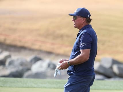 Phil Mickelson gives advice to an amateur in his group while playing the 11th green of the Pete Dye Stadium course during the third round of The American Express at PGA West in La Quinta, Calif., Saturday, Jan. 22, 2022.

Syndication Desert Sun