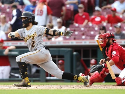 Sep 14, 2022; Cincinnati, Ohio, USA; Pittsburgh Pirates first baseman Michael Chavis (2) hits a two-run single against the Cincinnati Reds during the ninth inning at Great American Ball Park. Mandatory Credit: David Kohl-USA TODAY Sports