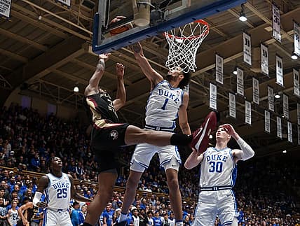 Dec 31, 2022; Durham, North Carolina, USA; Duke Blue Devils center Dereck Lively (1) blocks the shot of Florida State Seminoles guard Matthew Cleveland (35) during the first half at Cameron Indoor Stadium. Mandatory Credit: Rob Kinnan-USA TODAY Sports