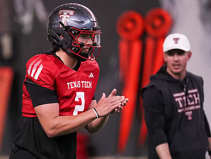 Texas Tech's Brendan Sorsby goes through a drill as offensive coordinator Mack Leftwich looks on during spring football