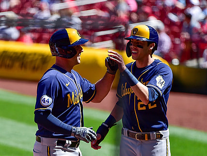 Apr 11, 2021; St. Louis, Missouri, USA;  Milwaukee Brewers third baseman Travis Shaw (21) celebrates with left fielder Christian Yelich (22) after hitting a three run home run off of St. Louis Cardinals starting pitcher Daniel Ponce de Leon (not pictured) during the second inning at Busch Stadium. Mandatory Credit: Jeff Curry-USA TODAY Sports