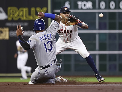 Aug 23, 2021; Houston, Texas, USA; Kansas City Royals catcher Salvador Perez (13) is out at second base as Houston Astros shortstop Carlos Correa (1) fields a throw during the first inning at Minute Maid Park. Mandatory Credit: Troy Taormina-USA TODAY Sports