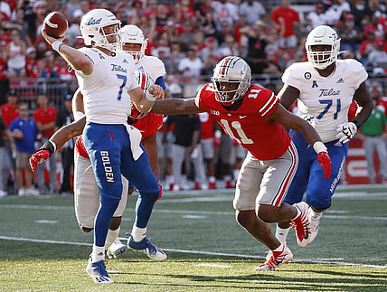 Ohio State defensive end Tyreke Smith pressures Tulsa quarterback Davis Brin.
