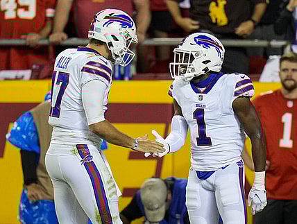 Oct 10, 2021; Kansas City, Missouri, USA; Buffalo Bills wide receiver Emmanuel Sanders (1) celebrates with quarterback Josh Allen (17) after scoring a touchdown against the Kansas City Chiefs during the first half at GEHA Field at Arrowhead Stadium. Mandatory Credit: Jay Biggerstaff-USA TODAY Sports