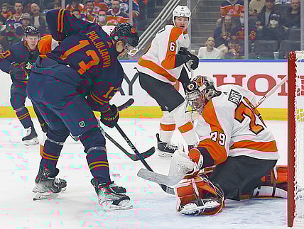 Oct 27, 2021; Edmonton, Alberta, CAN; Philadelphia Flyers goaltender Carter Hart (79) makes a save against Edmonton Oilers forward Jesse Puljujarvi (13) during the first period at Rogers Place. Mandatory Credit: Perry Nelson-USA TODAY Sports