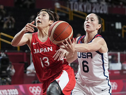 Aug 8, 2021; Saitama, Japan; United States guard Sue Bird (6) knocks the ball away from Japan point guard Rui Machida (13) in the women's basketball gold medal match during the Tokyo 2020 Olympic Summer Games at Saitama Super Arena. Mandatory Credit: James Lang-USA TODAY Sports