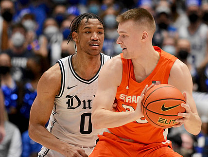 Jan 22, 2022; Durham, North Carolina, USA; Syracuse Orange guard Buddy Boeheim (35) controls the ball in front of Duke Blue Devils forward Wendell Moore Jr. (0) during the second half at Cameron Indoor Stadium. Mandatory Credit: Rob Kinnan-USA TODAY Sports