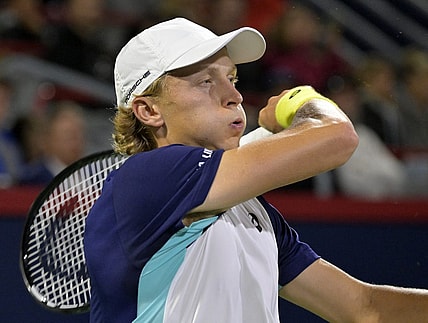 Aug 9, 2022; Montreal, QC, Canada; Emil Ruusuvuori (FIN) hits a forehand against Hubert Hurkacz (POL) (not pictured) in second round play in the National Bank Open at IGA Stadium. Mandatory Credit: Eric Bolte-USA TODAY Sports
