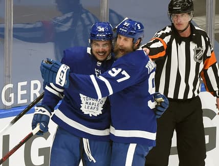Feb 18, 2021; Toronto, Ontario, CAN;  Toronto Maple Leafs forward Auston Matthews (34) is greeted by forward Joe Thornton (97) after scoring against Ottawa Senators in the first period at Scotiabank Arena. Mandatory Credit: Dan Hamilton-USA TODAY Sports