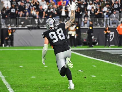 Jan 9, 2022; Paradise, Nevada, USA; Las Vegas Raiders defensive end Maxx Crosby (98) celebrates after sacking Los Angeles Chargers quarterback Justin Herbert (10) at Allegiant Stadium. Mandatory Credit: Stephen R. Sylvanie-USA TODAY Sports