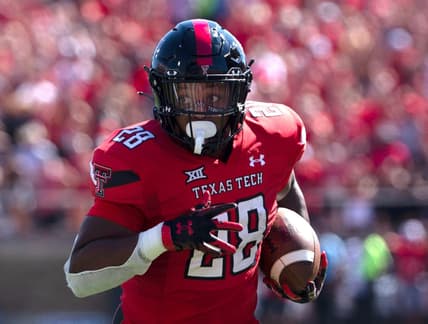 Texas Tech's running back Tahj Brooks (28) runs for a touchdown against Texas, Saturday, Sept. 24, 2022, at Jones AT&T Stadium.