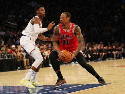 Mar 28, 2022; New York, New York, USA: Chicago Bulls forward DeMar DeRozan (11) drives to the basket against New York Knicks guard RJ Barrett (9) during the second half at Madison Square Garden. Mandatory Credit: Andy Marlin-USA TODAY Sports
