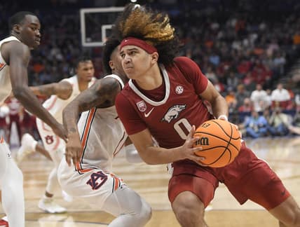Mar 9, 2023; Nashville, TN, USA;  Arkansas Razorbacks guard Anthony Black (0) drives ti the basket against the Auburn Tigers during the first half at Bridgestone Arena. Mandatory Credit: Steve Roberts-USA TODAY Sports