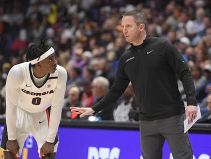 Mar 8, 2023; Nashville, TN, USA;  Georgia Bulldogs head coach Mike White talks with guard Terry Roberts (0) against the LSU Tigers during the first half at Bridgestone Arena. Mandatory Credit: Steve Roberts-USA TODAY Sports