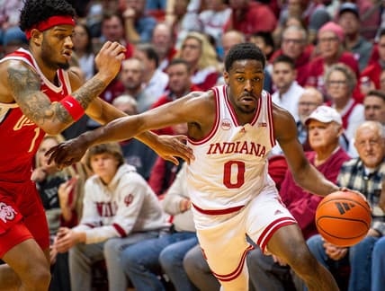 Indiana's Xavier Johnson (0) drives past Ohio State's Roddy Gayle Jr. (1) during the first half of the Indiana versus Ohio State men's basketball game at Simon Skjodt Assembly Hall on Saturday, Jan. 6, 2024.
