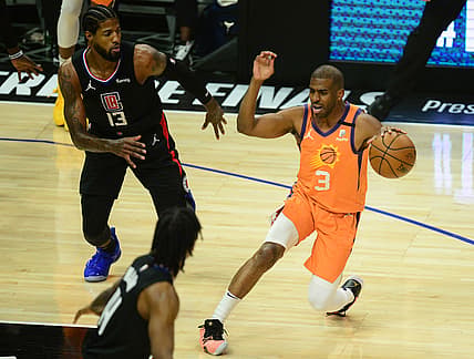 Jun 30, 2021; Los Angeles, California, USA; Phoenix Suns guard Chris Paul (3) controls the ball against Los Angeles Clippers guard Paul George (13) during the first half in game six of the Western Conference Finals for the 2021 NBA Playoffs at Staples Center. Mandatory Credit: Gary A. Vasquez-USA TODAY Sports