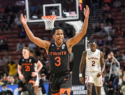 University of Miami guard Charlie Moore (3) celebrates after teammate forward Sam Waardenburg (21) dunked against Auburn University  during the second half of the NCAA Div. 1 Men's Basketball Tournament preliminary round game at Bon Secours Wellness Arena in Greenville, S.C. Sunday, March 20, 2022.

Ncaa Mens Basketball Second Round Miami Vs Auburn