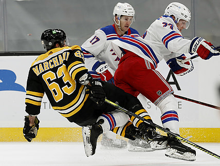 May 6, 2021; Boston, Massachusetts, USA; New York Rangers defenseman Adam Fox (23) collides with Boston Bruins center Brad Marchand (63) during the first period at TD Garden. Mandatory Credit: Winslow Townson-USA TODAY Sports
