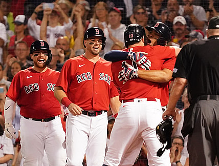 Aug 10, 2021; Boston, Massachusetts, USA; Boston Red Sox right fielder Hunter Renfroe (10) gets a hug from shortstop Xander Bogaerts (2) after hitting a three run home run against the Tampa Bay Rays during the fourth inning at Fenway Park. Mandatory Credit: David Butler II-USA TODAY Sports