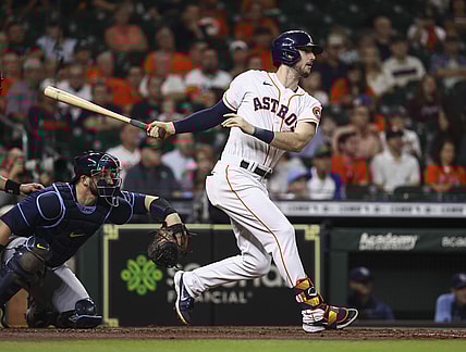Sep 30, 2021; Houston, Texas, USA; Houston Astros right fielder Kyle Tucker (30) hits a double during the second inning against the Tampa Bay Rays at Minute Maid Park. Mandatory Credit: Troy Taormina-USA TODAY Sports