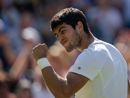 Jul 7, 2023; London, United Kingdom; Carlos Alcaraz (ESP) celebrates winning his match against Alexandre Muller (FRA) on day five of Wimbledon at the All England Lawn Tennis and Croquet Club.  Mandatory Credit: Susan Mullane-USA TODAY Sports