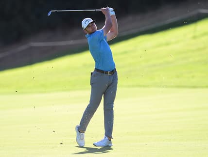 Feb 18, 2021; Pacific Palisades, California, USA; Sam Burns plays his shot on the eighteenth hole fairway during the first round of The Genesis Invitational golf tournament at Riviera Country Club. Mandatory Credit: Gary A. Vasquez-USA TODAY Sports