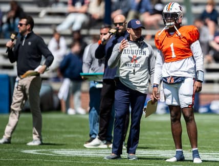 Auburn Tigers head coach Bryan Harsin talks with Auburn Tigers quarterback T.J. Finley (1) during the A-Day spring practice at Jordan-Hare Stadium in Auburn, Ala., on Saturday, April 9, 2022.