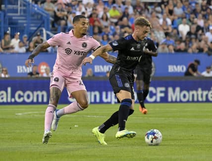 Aug 6, 2022; Montreal, Quebec, CAN; CF Montreal midfielder Djordje Mihailovic (8) plays the ball against Inter Miami CF midfielder Gregore (26) during the first half at Stade Saputo. Mandatory Credit: Eric Bolte-USA TODAY Sports