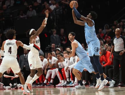 Nov 5, 2023; Portland, Oregon, USA;  Memphis Grizzlies forward Jaren Jackson Jr. (13) shoots the ball over Portland Trail Blazers forward Jerami Grant (9) at Moda Center. Mandatory Credit: Jaime Valdez-USA TODAY Sports