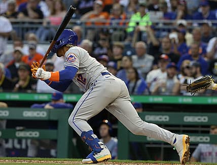 Sep 7, 2022; Pittsburgh, Pennsylvania, USA; New York Mets shortstop Francisco Lindor (12) hits a two run double down the right field line against the Pittsburgh Pirates during the second inning at PNC Park. Mandatory Credit: Charles LeClaire-USA TODAY Sports