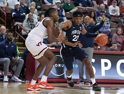 Nov 18, 2022; Charleston, South Carolina, USA; Penn State Nittany Lions guard Jalen Pickett (22) drives against Virginia Tech Hokies forward Justyn Mutts (25) in the second half at TD Arena. Mandatory Credit: David Yeazell-USA TODAY Sports