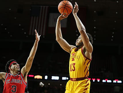 Iowa State University Cyclones guard Jaren Holmes (13)  takes a three-point shot over St. Johns Red Storm guard Andre Curbelo (3) during the first half at Hilton Coliseum Sunday, Dec. 4, 2022, in Ames, Iowa.  Photo by Nirmalendu Majumdar/Ames Tribune

St Jhon S And Iowa State Men S Basketball