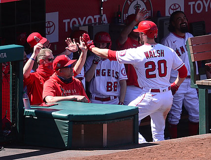 May 23, 2021; Anaheim, California, USA; Los Angeles Angels first baseman Jared Walsh (20) is greeted after hitting a solo home run against the Oakland Athletics during the sixth inning at Angel Stadium. Mandatory Credit: Gary A. Vasquez-USA TODAY Sports
