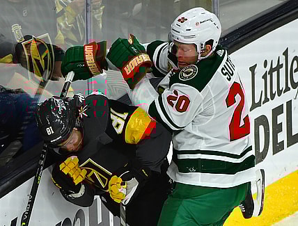 May 18, 2021; Las Vegas, Nevada, USA; Minnesota Wild defenseman Ryan Suter (20) hits Vegas Golden Knights center Jonathan Marchessault (81) during the first period of game two of the first round of the 2021 Stanley Cup Playoffs at T-Mobile Arena. Mandatory Credit: Stephen R. Sylvanie-USA TODAY Sports