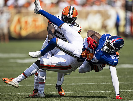 Aug 22, 2021; Cleveland, Ohio, USA; New York Giants wide receiver Damion Willis (87) falls as Cleveland Browns cornerback A.J. Green (38) tackles him during the fourth quarter at FirstEnergy Stadium. Mandatory Credit: Scott Galvin-USA TODAY Sports