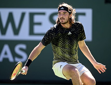 Oct 15, 2021; Indian Wells, CA, USA;   Stefanos Tsitsipas (GRE)hits a shot during his quarter final match against Nikoloz Basilashvili (GEO) during the BNP Paribas Open at the Indian Wells Tennis Garden. Mandatory Credit: Jayne Kamin-Oncea-USA TODAY Sports