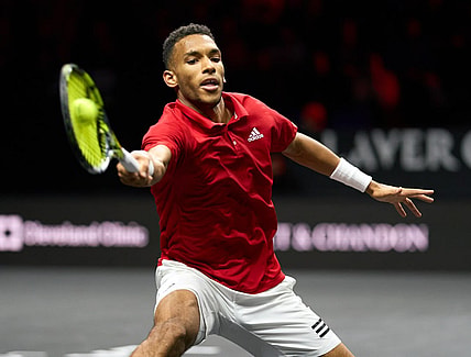 Sep 25, 2022; London, United Kingdom; Felix Auger-Aliassime (CAN) plays a shot against Novak Djokovic (SRB) in Lavers Cup singles. Mandatory Credit: Peter van den Berg-USA TODAY Sports