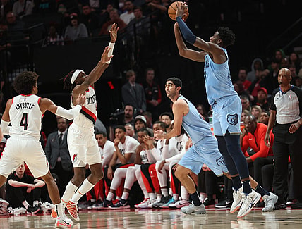Nov 5, 2023; Portland, Oregon, USA;  Memphis Grizzlies forward Jaren Jackson Jr. (13) shoots the ball over Portland Trail Blazers forward Jerami Grant (9) at Moda Center. Mandatory Credit: Jaime Valdez-USA TODAY Sports