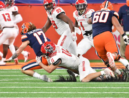 Nov 28, 2020; Syracuse, New York, USA; North Carolina State Wolfpack linebacker Payton Wilson (11) sacks Syracuse Orange quarterback Rex Culpepper (17) in the fourth quarter at the Carrier Dome. Mandatory Credit: Mark Konezny-USA TODAY Sports