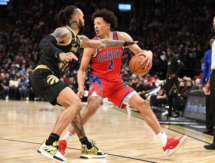 Nov 13, 2021; Toronto, Ontario, CAN; Detroit Pistons guard Cade Cunningham (2) dribbles the ball while defended by Toronto Raptors guard Gary Trent Jr. 33) in the first half at Scotiabank Arena. Mandatory Credit: Dan Hamilton-USA TODAY Sports