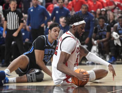 Texas Tech's forward Warren Washington (22) attempts to grab a loose ball against BYU in a Big 12 basketball game, Saturday, Jan. 20, 2024, at United Supermarkets Arena.