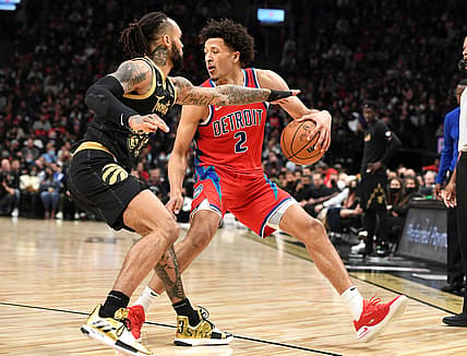Nov 13, 2021; Toronto, Ontario, CAN; Detroit Pistons guard Cade Cunningham (2) dribbles the ball while defended by Toronto Raptors guard Gary Trent Jr. 33) in the first half at Scotiabank Arena. Mandatory Credit: Dan Hamilton-USA TODAY Sports
