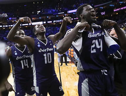Saint Peter's (from left) Hassen Drame, Fousseyni Drame and Oumar Diahame leave the court after the Peacocks' 67-64 win against Purdue to advance to the Elite Eight in the NCAA tournament at the Wells Fargo Center in Philadelphia, March 25, 2022.

Ncaa Basketball Ncaa Tournament Saint Peter S Vs Purdue In Sweet 16 Saint Peter S At Purdue