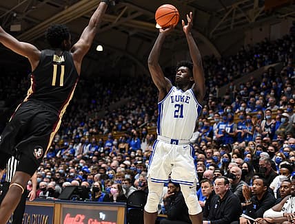 Feb 19, 2022; Durham, North Carolina, USA; Duke Blue Devils forward AJ Griffin (21) shoots over Florida State Seminoles center Tanor Ngom (11) during the second half at Cameron Indoor Stadium. Mandatory Credit: Rob Kinnan-USA TODAY Sports