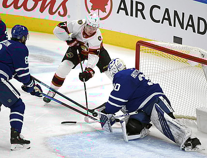 Feb 18, 2021; Toronto, Ontario, CAN;  Ottawa Senators forward Brady Tkachuk (7) shoots the puck as Toronto Maple Leafs goalie Michael Hutchinson (30) defends in the first period at Scotiabank Arena. Mandatory Credit: Dan Hamilton-USA TODAY Sports
