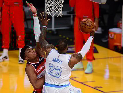 Feb 22, 2021; Los Angeles, California, USA; Los Angeles Lakers forward LeBron James (23) moves to the basket against Washington Wizards forward Rui Hachimura (8) during overtime at Staples Center. Mandatory Credit: Gary A. Vasquez-USA TODAY Sports