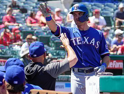 Sep 5, 2021; Anaheim, California, USA; Texas Rangers designated hitter DJ Peters (38) celebrates hitting a solo home run in the second inning against the Los Angeles Angels at Angel Stadium. Mandatory Credit: Robert Hanashiro-USA TODAY Sports